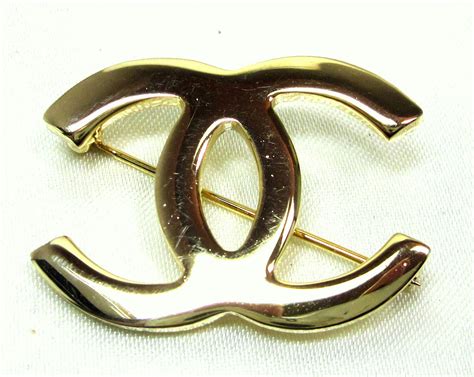 fake chanel logo pin|knockoff Chanel brooch.